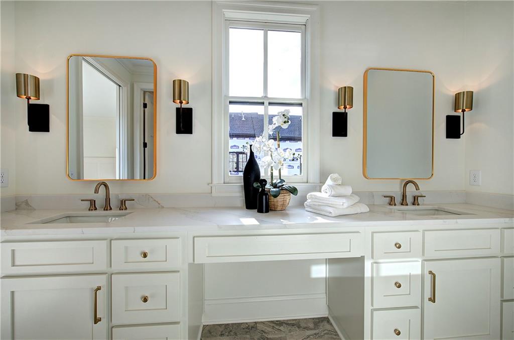178 West Main Street, Unit 102 Cartersville, GA 30120 - Photo 28 of 50 a bathroom with a granite countertop sink and a mirror