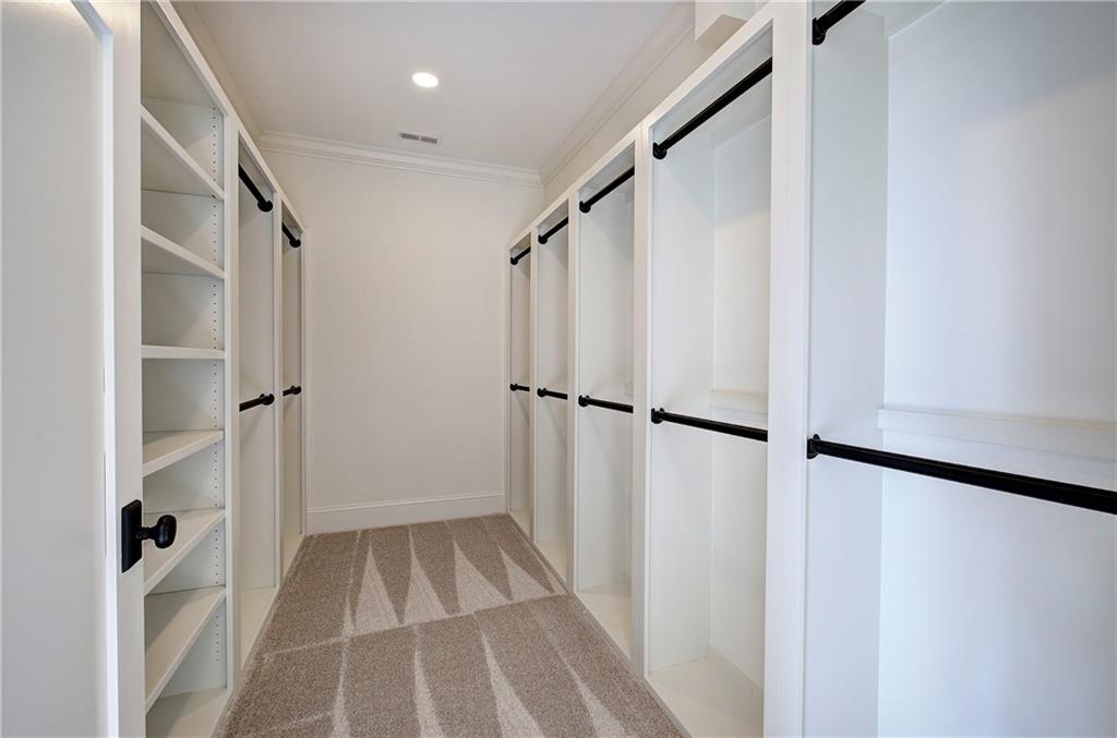 178 West Main Street, Unit 102 Cartersville, GA 30120 - Photo 29 of 50 a view of a hallway with wooden floor and staircase