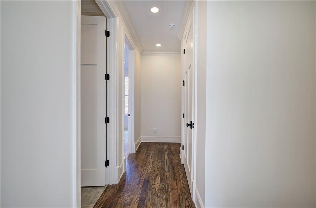 178 West Main Street, Unit 102 Cartersville, GA 30120 - Photo 30 of 50 a view of a hallway with wooden floor