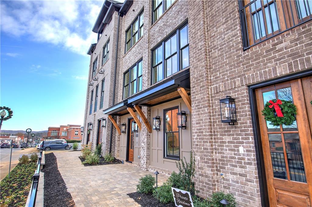 178 West Main Street, Unit 102 Cartersville, GA 30120 - Photo 3 of 50 a front view of a building with large windows