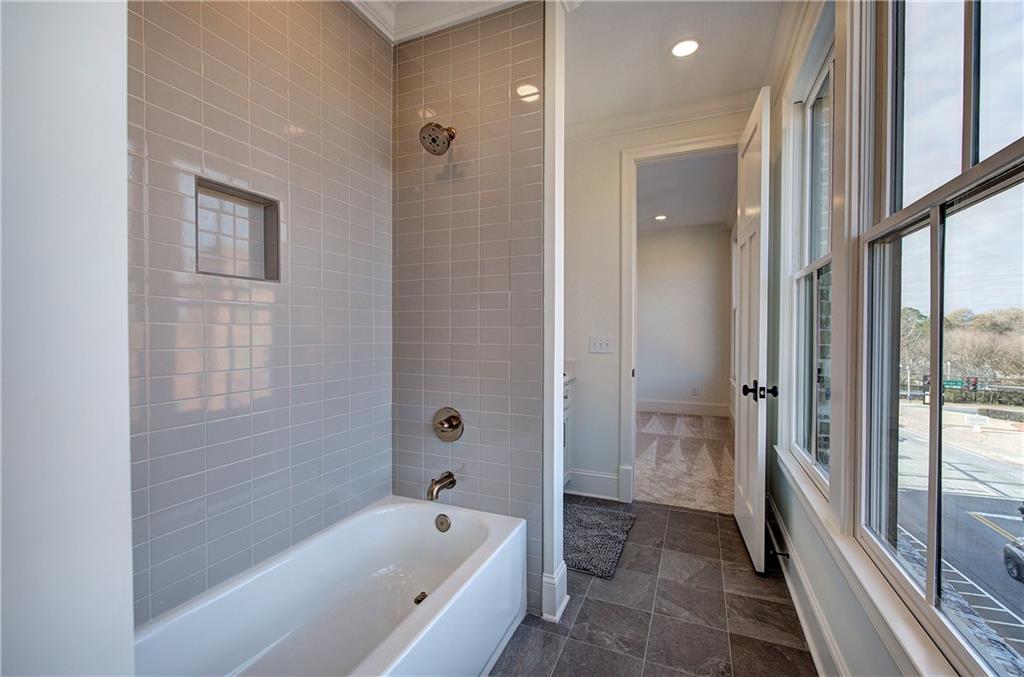 178 West Main Street, Unit 102 Cartersville, GA 30120 - Photo 35 of 50 a bathroom with a bathtub and shower