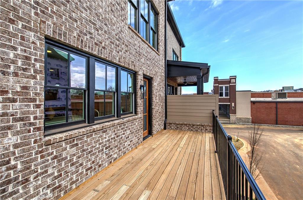 178 West Main Street, Unit 102 Cartersville, GA 30120 - Photo 42 of 50 a view of a balcony with wooden floor and outdoor space