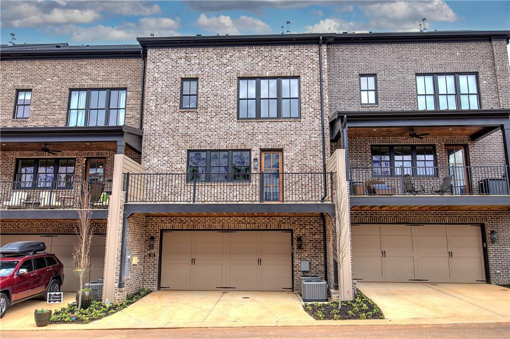 178 West Main Street, Unit 102 Cartersville, GA 30120 - Photo 44 of 50 a living room with stainless steel appliances kitchen island a fireplace