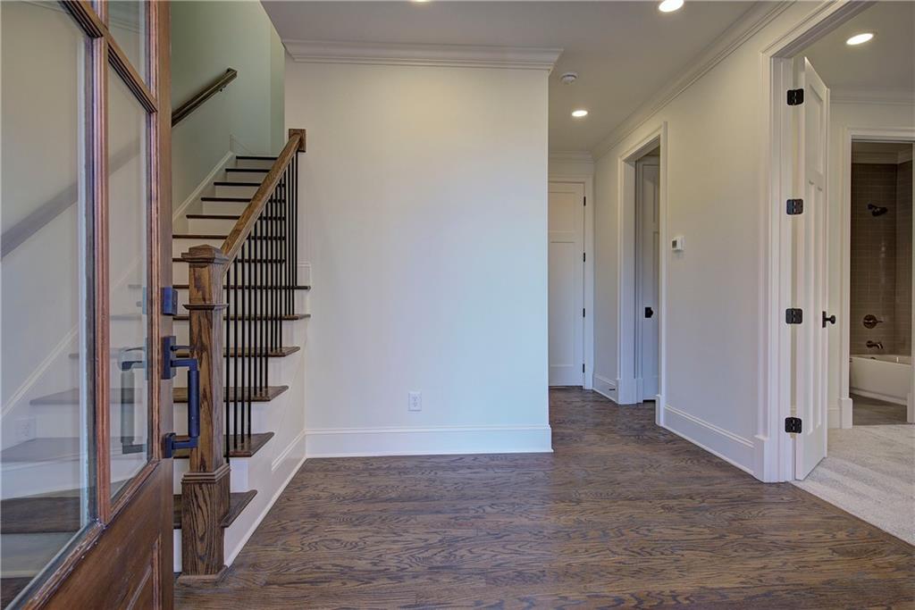 178 West Main Street, Unit 102 Cartersville, GA 30120 - Photo 5 of 50 a view of a hallway with entryway wooden floor and front door
