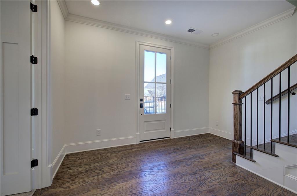 178 West Main Street, Unit 102 Cartersville, GA 30120 - Photo 6 of 50 an empty room with wooden floor and windows