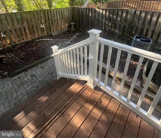a view of outdoor space with deck and yard