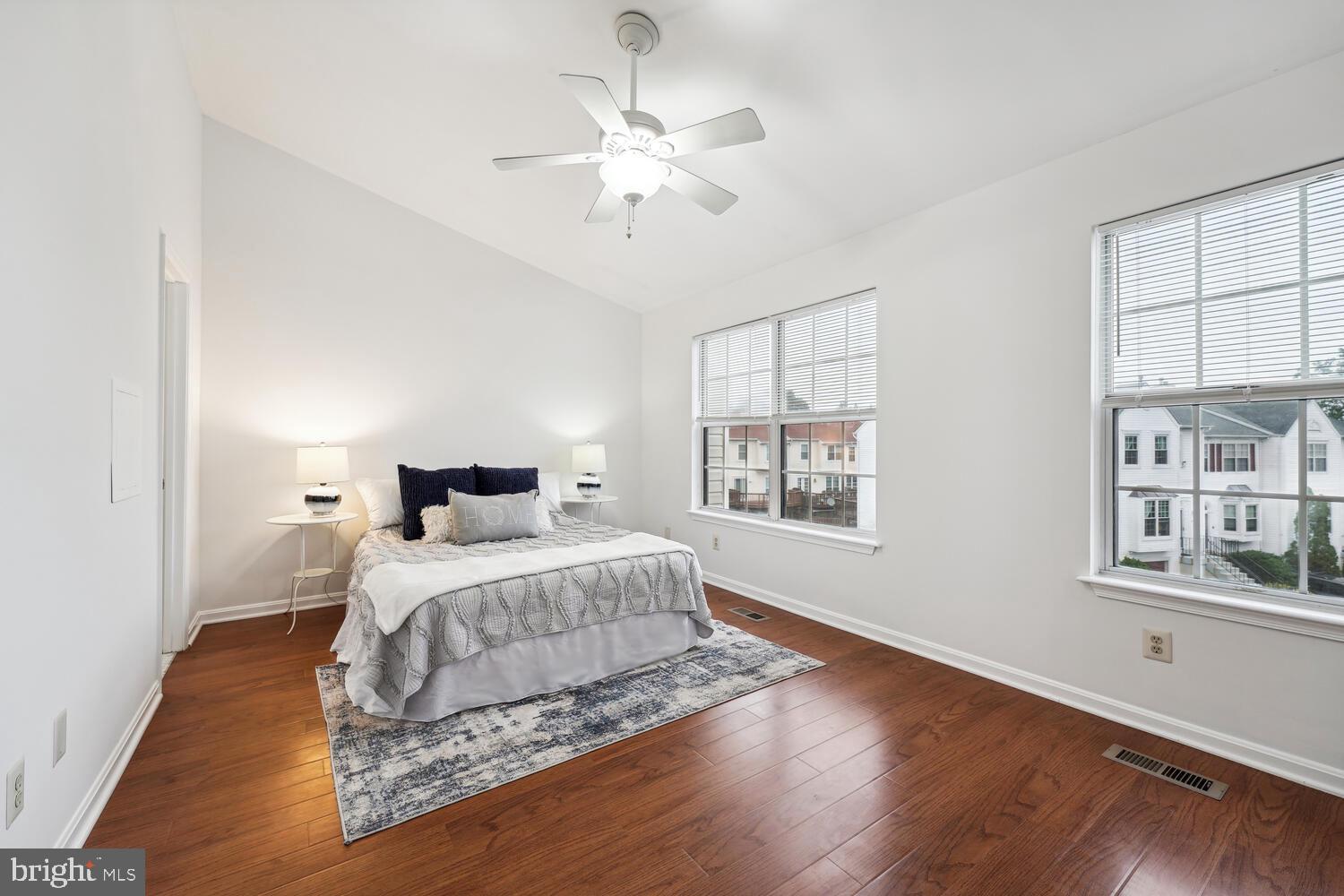 6817 Signature Circle Alexandria, VA 22310 - Photo 18 of 25 a bedroom with a large bed chandelier and a window