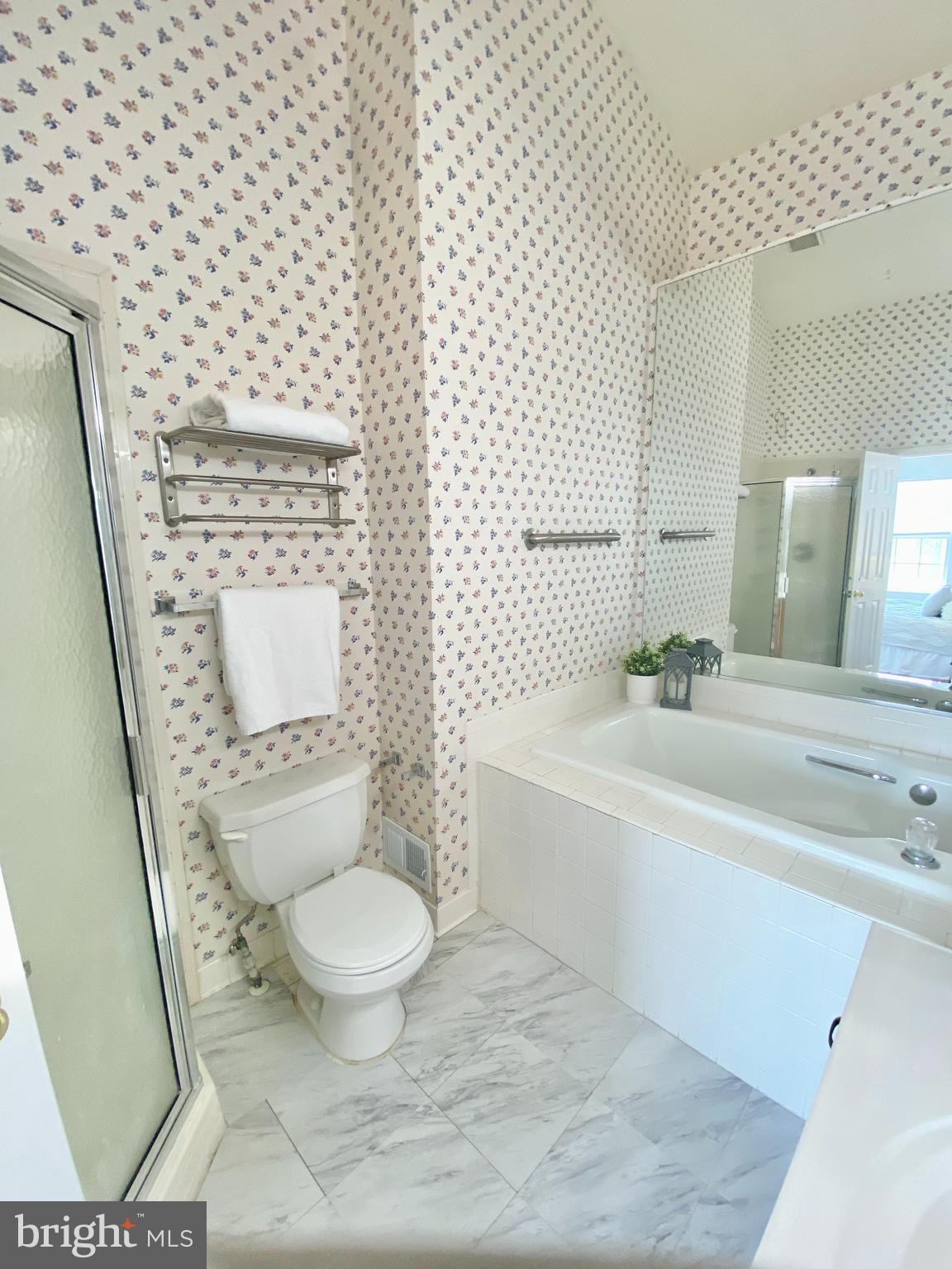 6817 Signature Circle Alexandria, VA 22310 - Photo 20 of 25 a white toilet sitting next to a bathroom sink