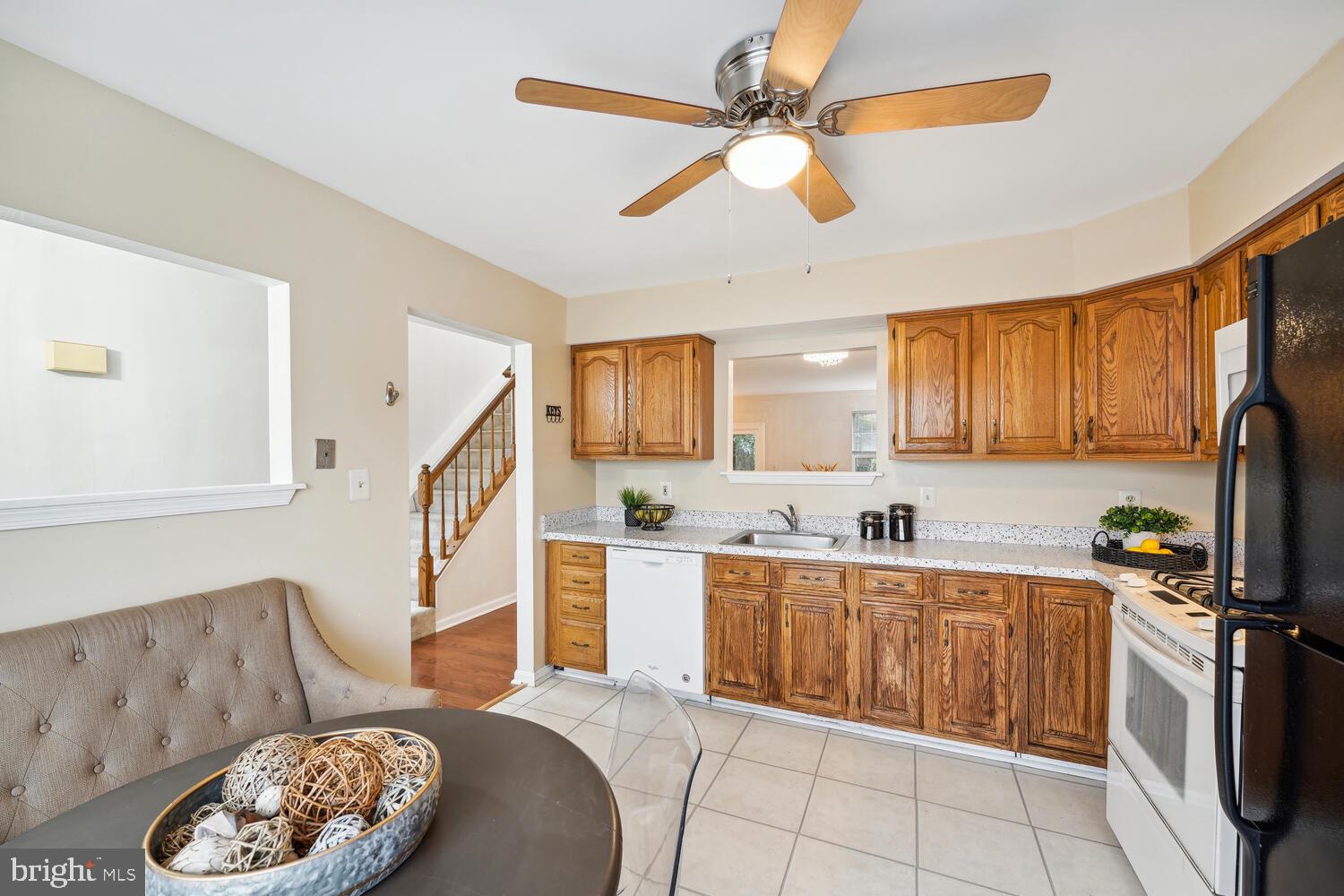 6817 Signature Circle Alexandria, VA 22310 - Photo 5 of 25 a kitchen with a sink a stove and cabinets