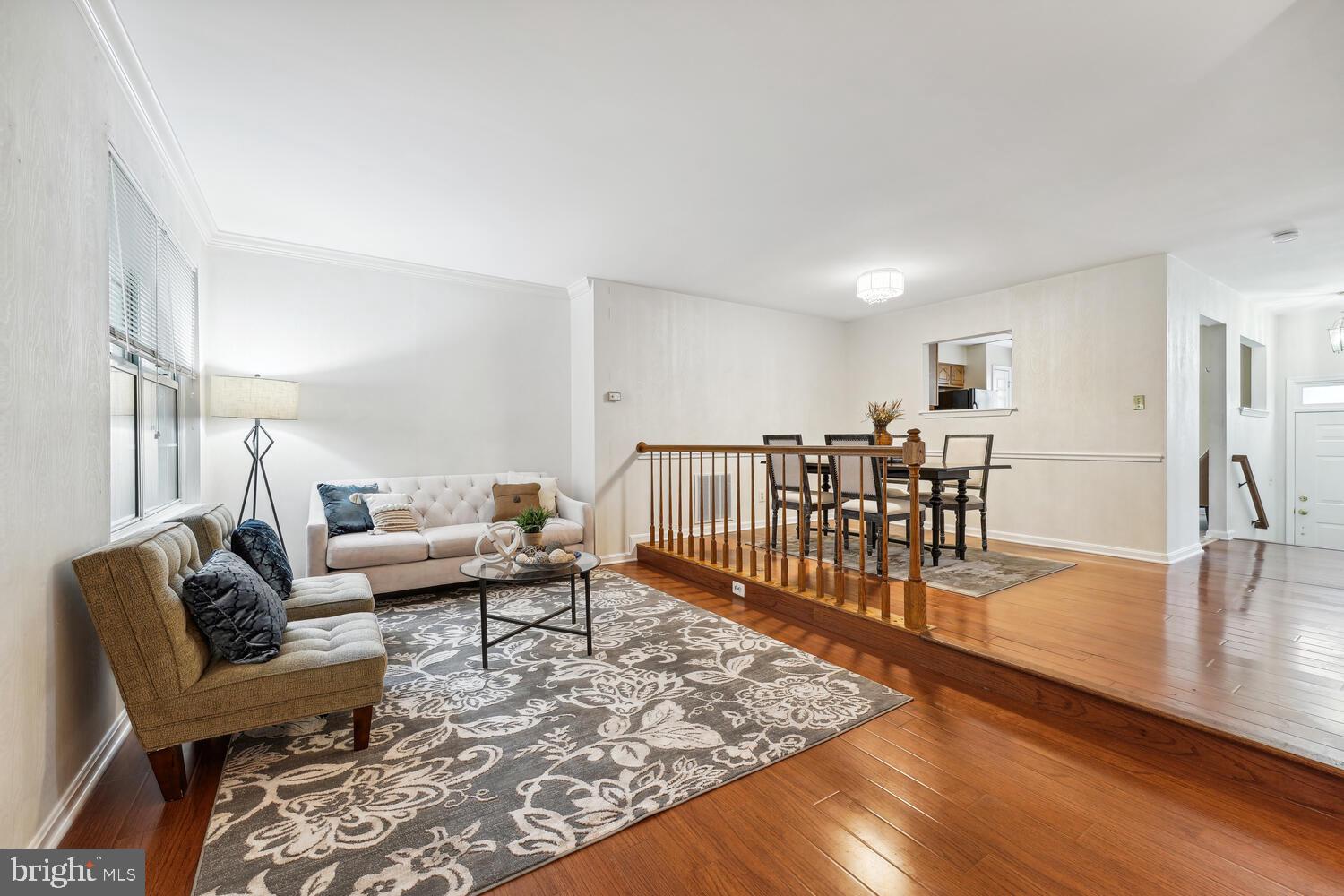 6817 Signature Circle Alexandria, VA 22310 - Photo 10 of 25 a living room with furniture and a wooden floor