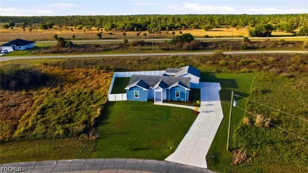 a view of a lake with a house in the background