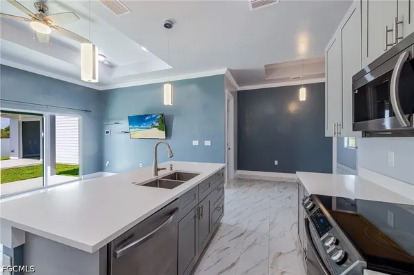 a kitchen with a sink and a refrigerator