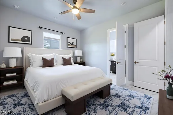 a bedroom with a bed and a chandelier