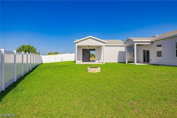 a front view of a house with yard and green space