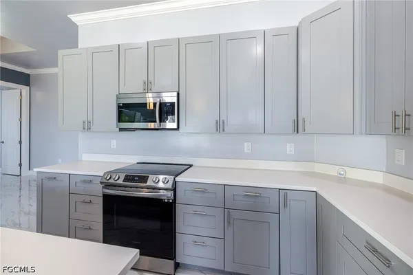 a kitchen with a sink and cabinets