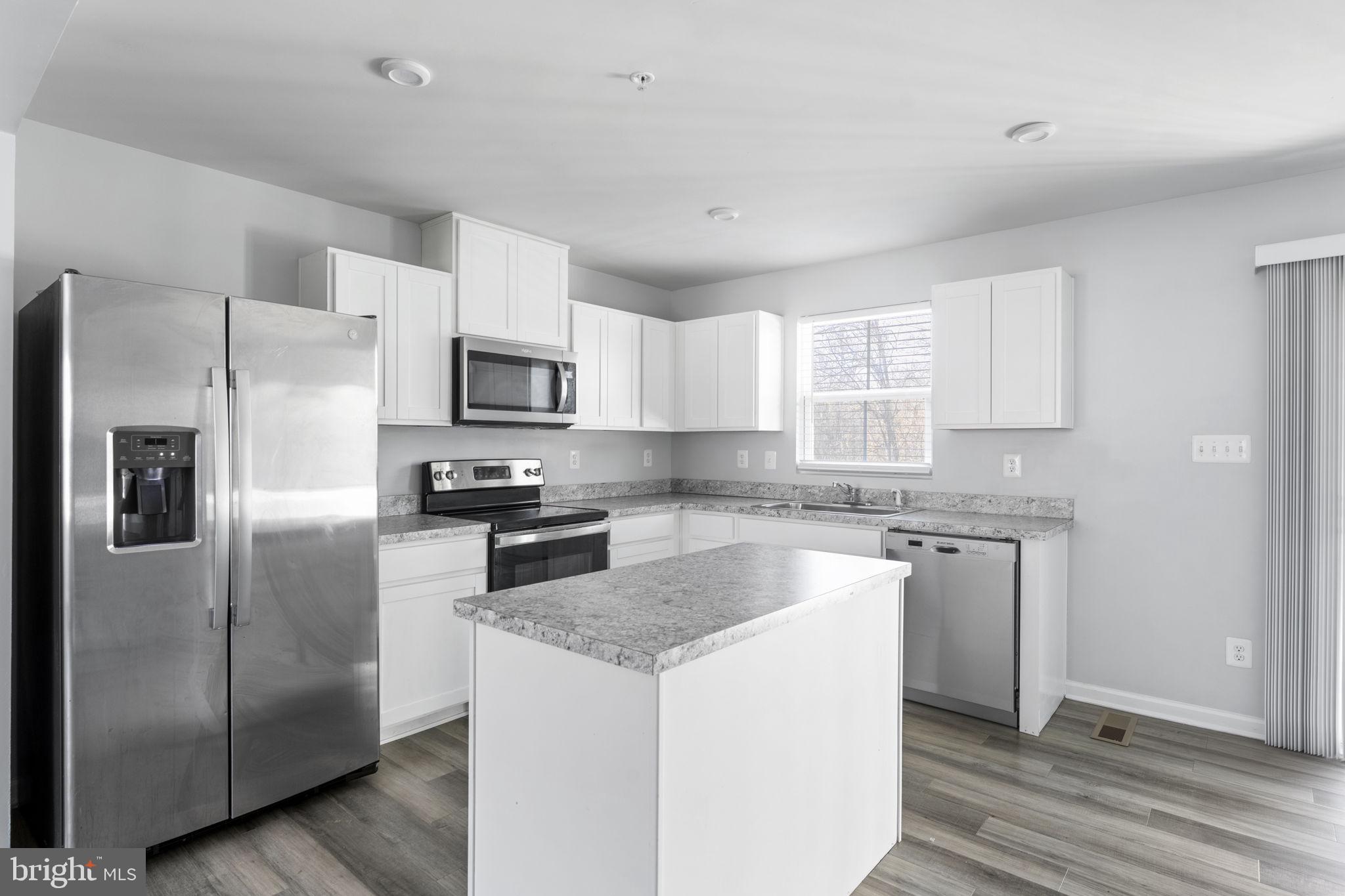 152 Ben Boulevard Elkton, MD 21921 - Photo 6 of 34 a kitchen with a refrigerator sink and microwave