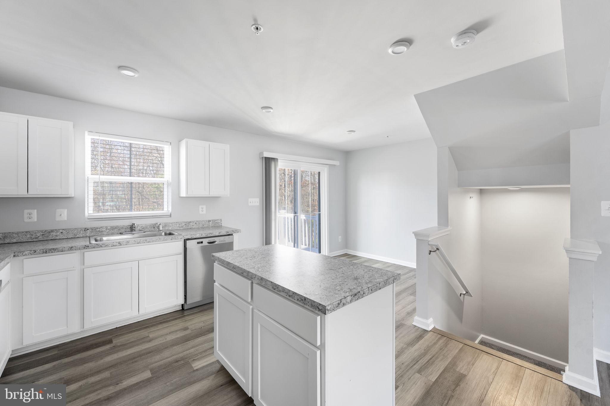 152 Ben Boulevard Elkton, MD 21921 - Photo 8 of 34 a kitchen with granite countertop a sink and cabinets