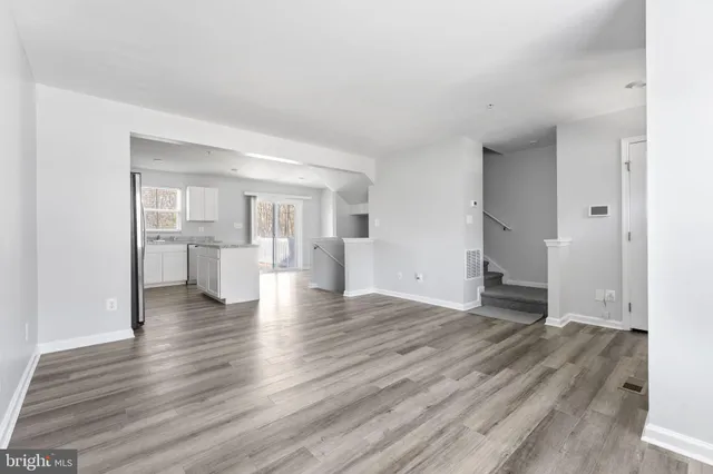 a view of a livingroom with wooden floor