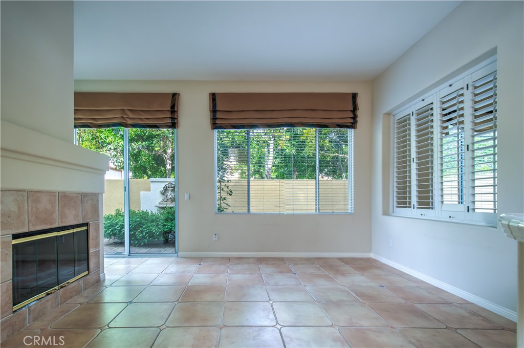 2 Altezza Irvine, CA 92606 - Photo 18 of 66 a view of an empty room with windows and a fireplace