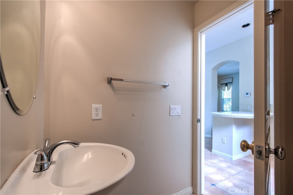 2 Altezza Irvine, CA 92606 - Photo 26 of 66 a bathroom with a sink and mirror
