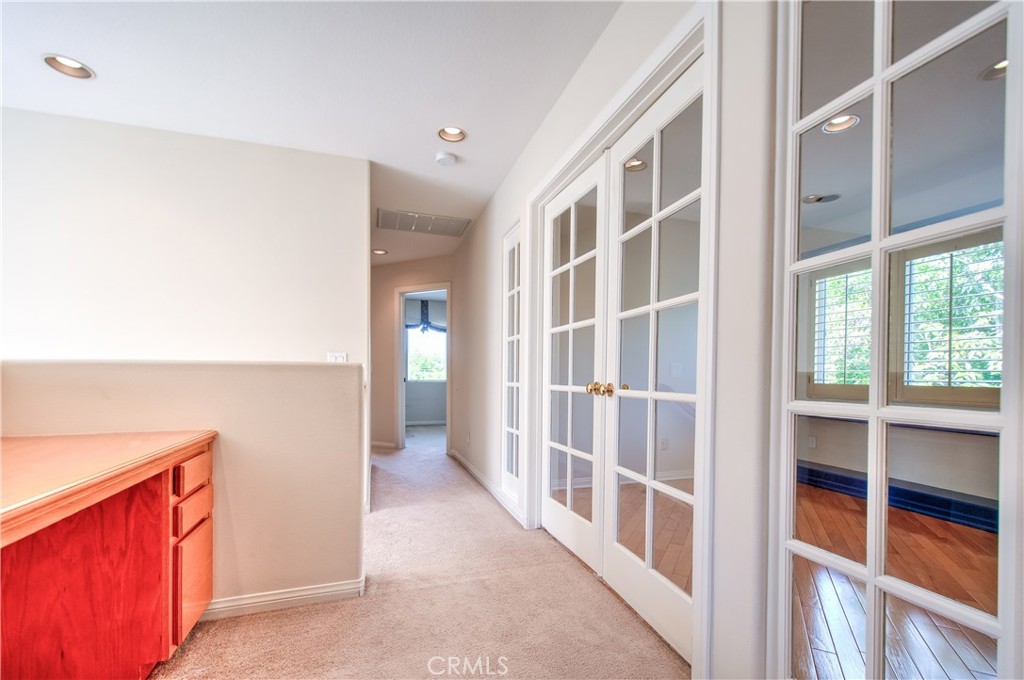 2 Altezza Irvine, CA 92606 - Photo 31 of 66 a view of a hallway with a large window and wooden floor