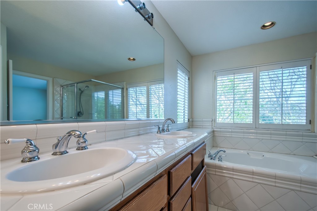 2 Altezza Irvine, CA 92606 - Photo 43 of 66 a bathroom with a granite countertop sink and a bathtub