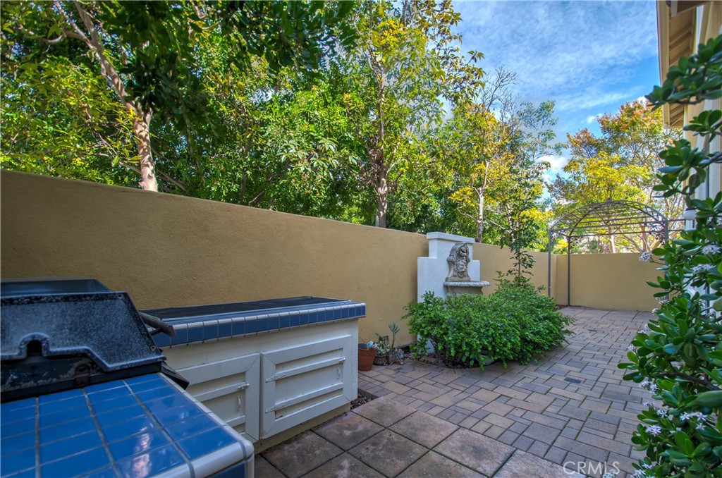 2 Altezza Irvine, CA 92606 - Photo 62 of 66 a view of a backyard with plants and a tree