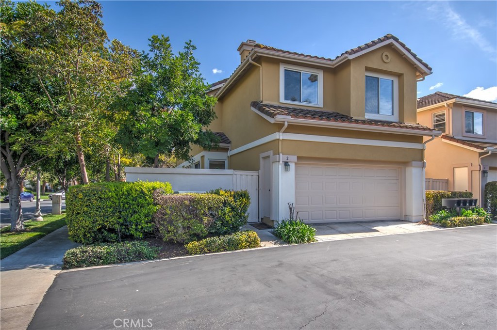 2 Altezza Irvine, CA 92606 - Photo 64 of 66 a front view of a house with a yard and garage