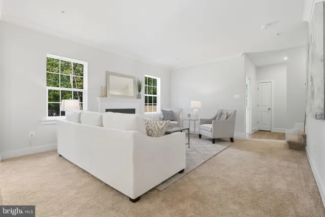 a spacious bedroom with a bed and a window