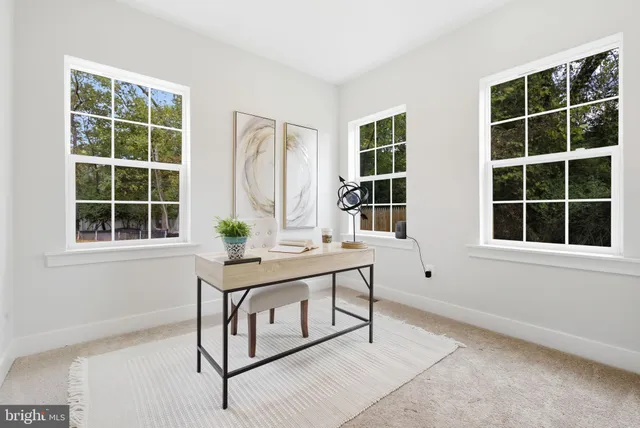 a bedroom with a bed and a painting