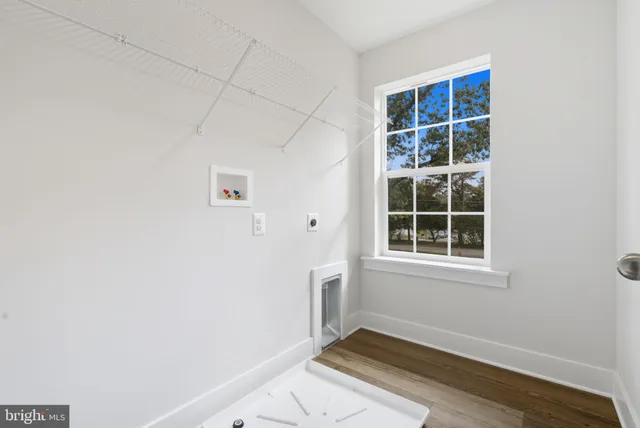 an aerial view of a house with a yard basket ball court and outdoor seating