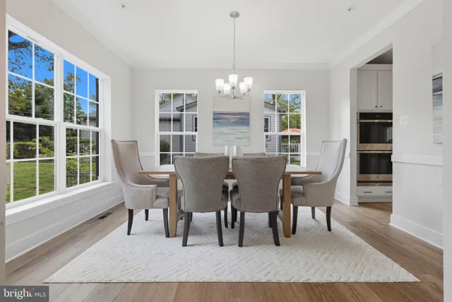 a large white kitchen with lots of counter top space