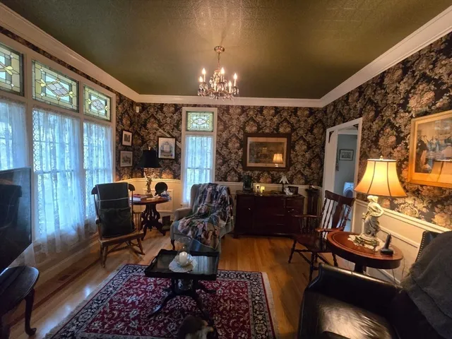 a living room with lots of furniture and a chandelier