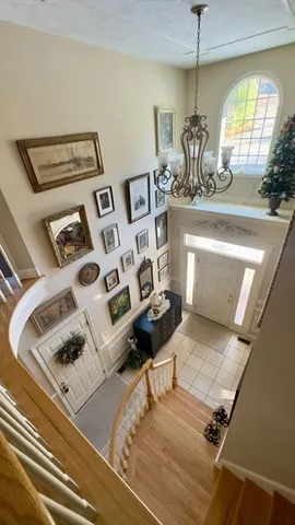 a view of living room with furniture and a chandelier