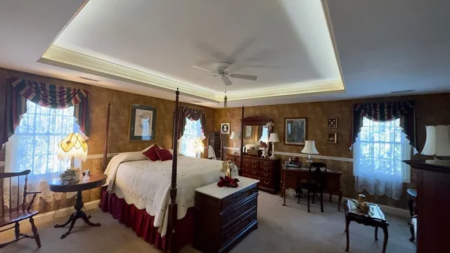 a bed room with a bed and a chandelier