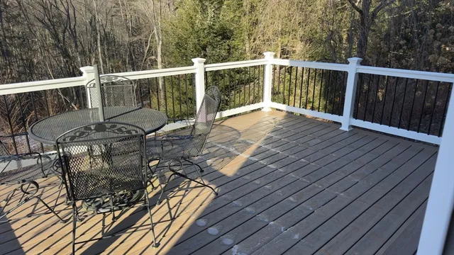 a view of a balcony with wooden floor