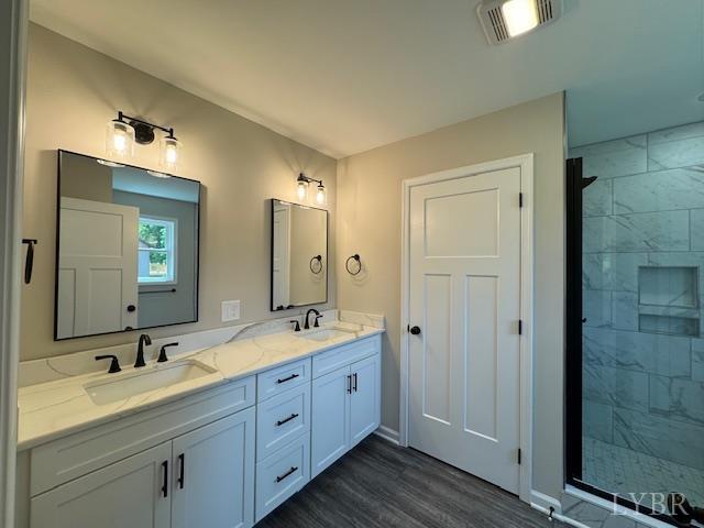 2274 Spg Grv Road Spout Spring, VA 24593 - Photo 3 of 21 a bathroom with double vanity sinks a vanity a mirror and a shower