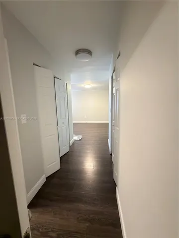 a view of gallery with wooden floor