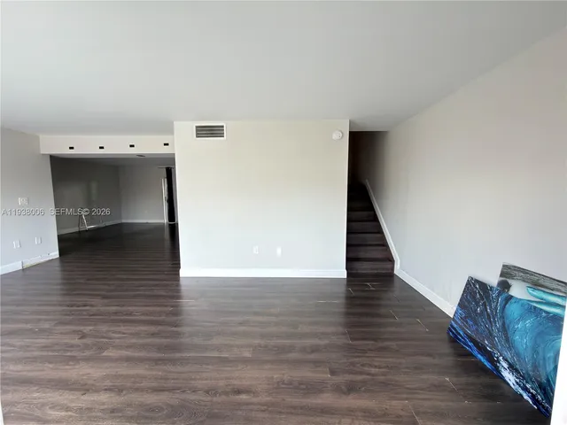 a view of a livingroom with wooden floor
