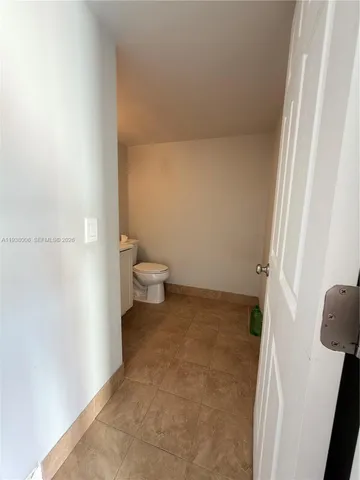 a bathroom with a sink and toilet