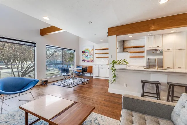 a living room with furniture and a large window