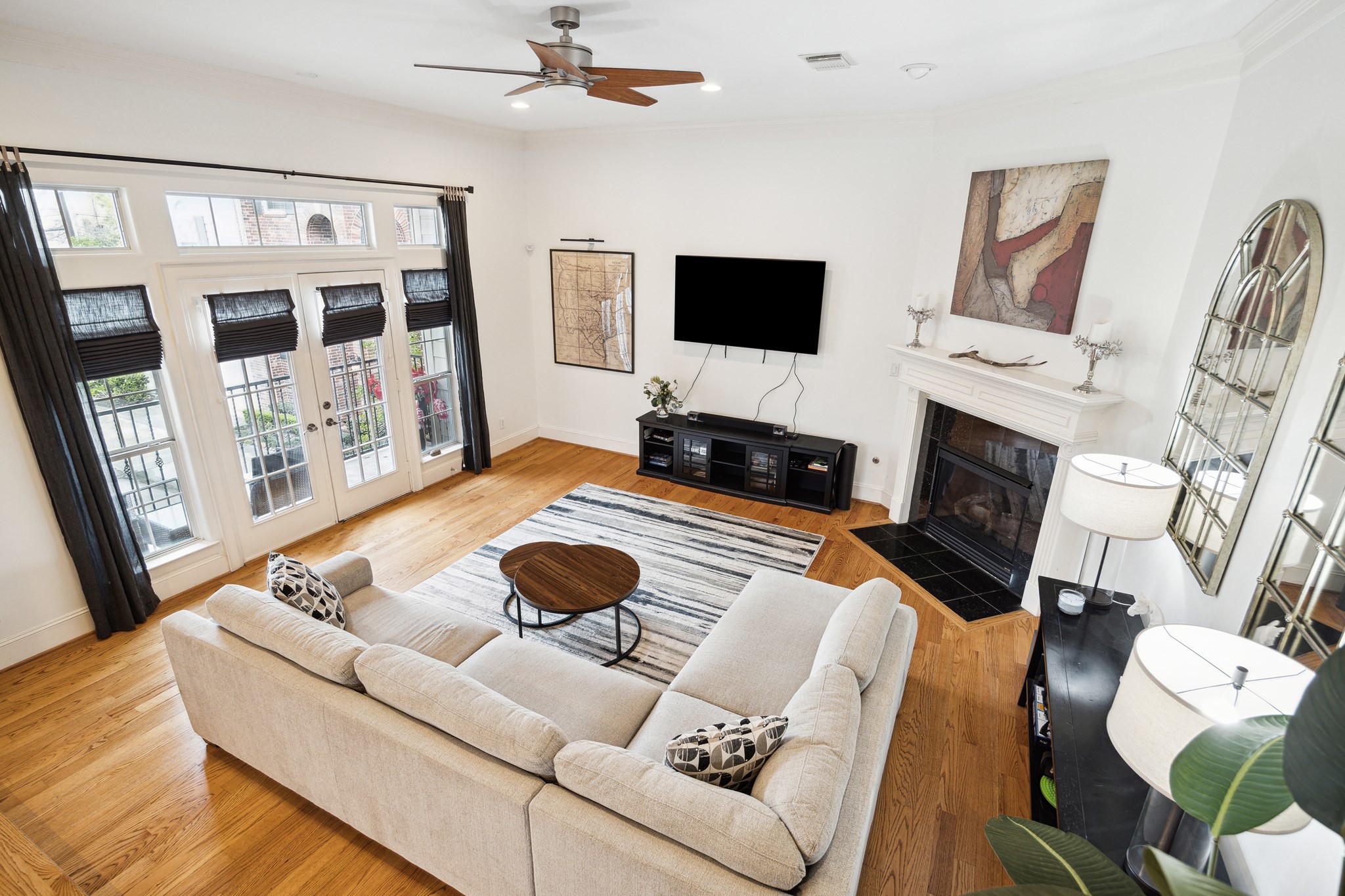 a living room with furniture fireplace and flat screen tv
