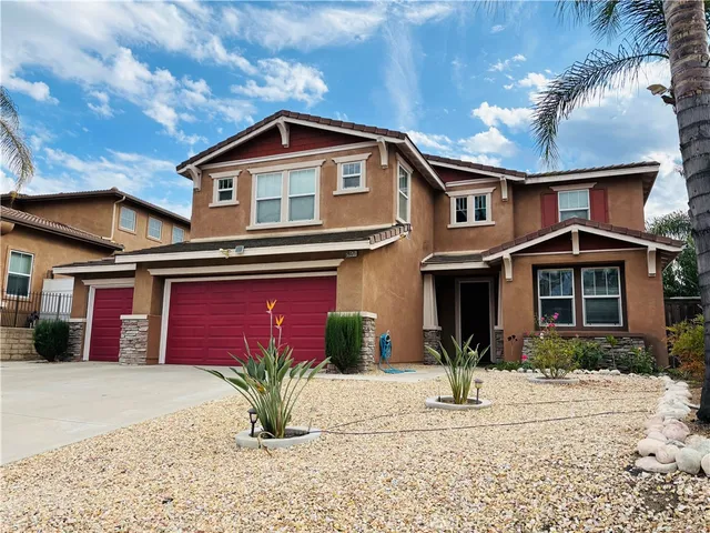 a front view of a house with garage