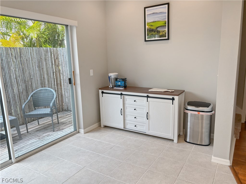 3269 Amanda Lane, Unit 2 Naples, FL 34109 - Photo 11 of 38 a view of workspace with furniture and window
