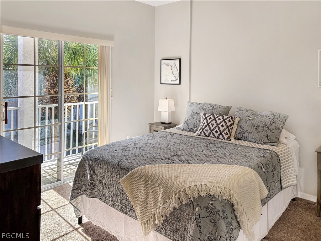 3269 Amanda Lane, Unit 2 Naples, FL 34109 - Photo 18 of 38 a bedroom with a bed and a window