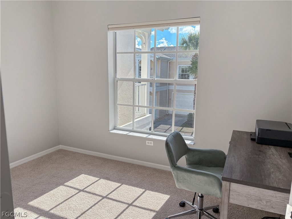 3269 Amanda Lane, Unit 2 Naples, FL 34109 - Photo 22 of 38 a workspace with furniture and window