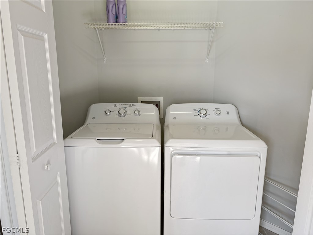 3269 Amanda Lane, Unit 2 Naples, FL 34109 - Photo 24 of 38 a utility room with dryer and washer