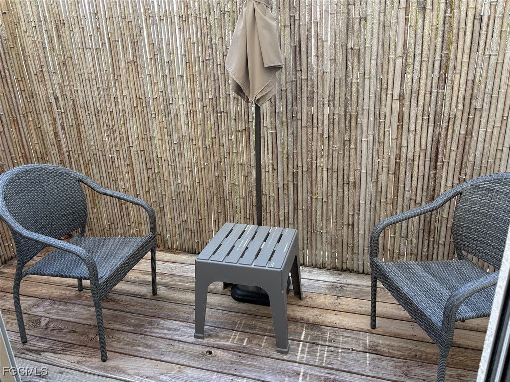 3269 Amanda Lane, Unit 2 Naples, FL 34109 - Photo 28 of 38 a view of a balcony with chairs
