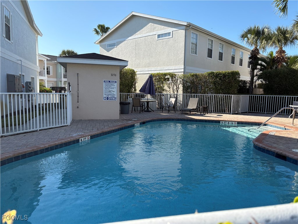 3269 Amanda Lane, Unit 2 Naples, FL 34109 - Photo 29 of 38 a view of a house with swimming pool and porch