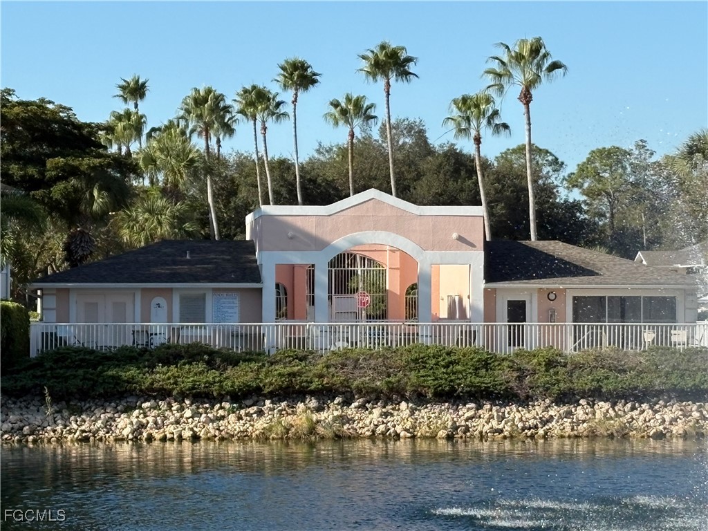 3269 Amanda Lane, Unit 2 Naples, FL 34109 - Photo 30 of 38 a front view of a house with a garden